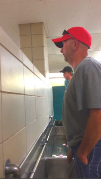 cocks peeing|long heavy uncut cock pissing in public at trough urinal .